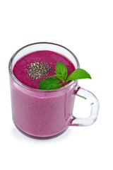 Glass of homemade blueberries smoothie and fresh mint leaf