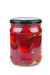 Cherry plums canned in glass jar isolated on white background