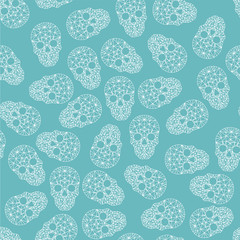 seamless background. White skulls on a blue background. Skulls of polygons and lines