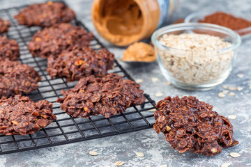 Flourless no bake peanut butter and oatmeal chocolate cookies on  cooling rack, horizontal