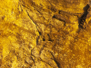 Typical detail of an ancient wall of an Italian house in Rimini, on the Adriatic coast, made of hand-carved stones.