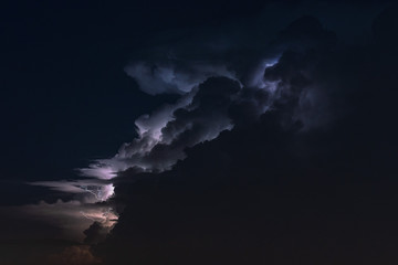 Naklejka na ściany i meble Beautiful lightning and cumulonimbus cloud at night