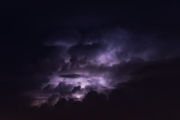 Naklejka na ściany i meble Beautiful lightning and cumulonimbus cloud at night