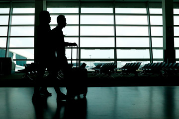 silhouette shadow in airport man woman walking shadow