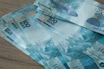 Brazilian money on a table. 100 hundred reais