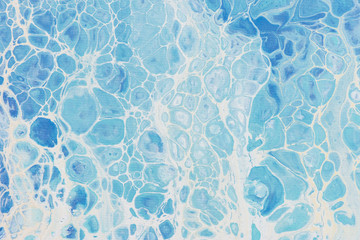 Beautiful background of liquid acrylic in blue and white on canvas