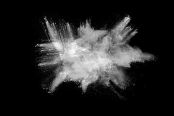 White powder explosion on black background. Colored cloud. Colorful dust explode. Paint Holi.