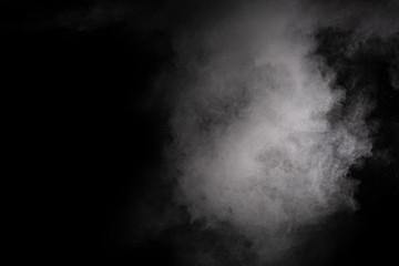 White powder explosion on black background. Colored cloud. Colorful dust explode. Paint Holi.