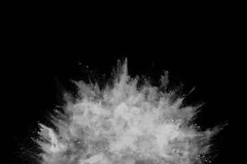 White powder explosion on black background. Colored cloud. Colorful dust explode. Paint Holi.