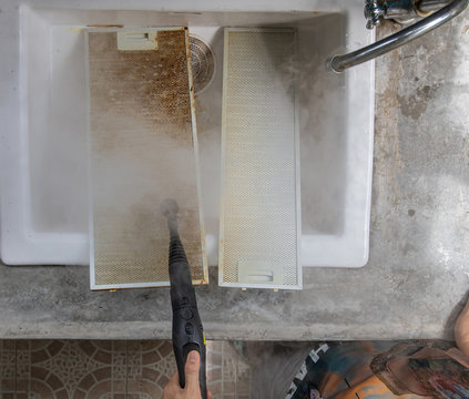 Cleaning aluminum filter for kitchen hood.