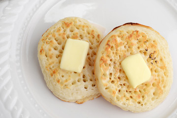 closeup top view english crumpets with butter