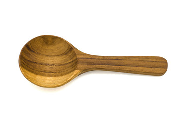 One wooden spoon is placed on a white background.