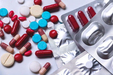 Close up medicine and capsules on white background.colorful drug for treatment medication.Capsules...