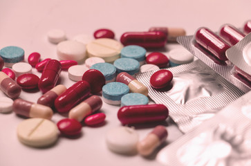 Close up medicine and capsules on white background.colorful drug for treatment medication.Capsules , packages,capsule pills.Photo concept take care and background.