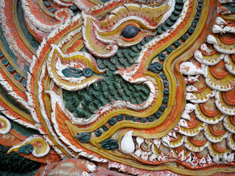 Closeup of Stucco image at the temple gate in Thailand with selective focus.