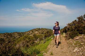 Girl walking on the path with special sticks