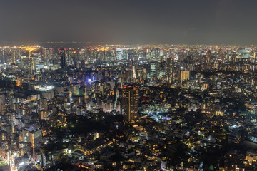 Fototapeta na wymiar Streets of Night Tokio from Above with majic nightlights all around.