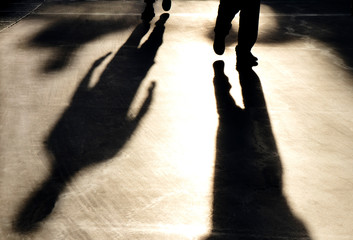 Blurry reflection shadow silhouette of  men walking on pedestrian road - 273491203