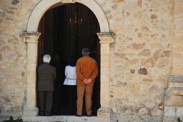 Fototapeta na wymiar Group of people waiting at the entrance of a church