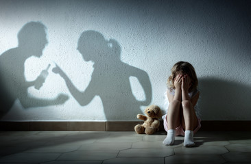 Little Girl Crying With Shadow Of Parents Arguing - Home Violence And Divorce