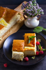 Cottage cheese pie on black plate