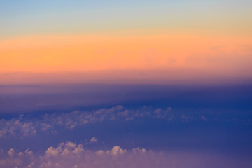 Beautiful sunset sky above clouds with dramatic light