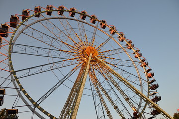 ferris wheel on background of blue sky