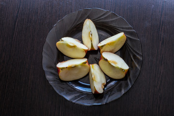 Slices of delicious red apple on a plate, healthy food and food, for diet and fitness