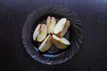 Sliced ​​apples on a plate for diet and healthy eating