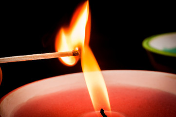 Igniting matches from a candle fire. Sulfur ignition close up. Macro shooting. - Powered by Adobe