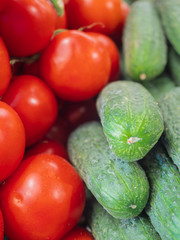 view of several types of peppers on the shelves of a fruit shop