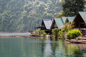 Tropical lakeside hut in ratchaprapa dam or Cheow Lan Dam Suratthani, Thailand.