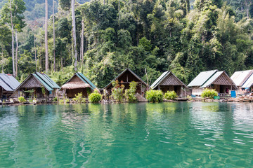 Fototapeta na wymiar Tropical lakeside hut in ratchaprapa dam or Cheow Lan Dam Suratthani, Thailand.