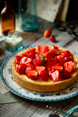 Homemade delicious strawberry tart or pie with sweet berries on top