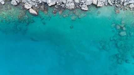 Fototapeta na wymiar Aerial view to clear blue green sea with rocks, beautiful nature background