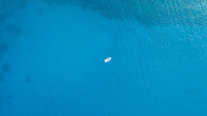 One romantic alone boat in blue sea, bird's eyes view, Greece, Rhodes island.