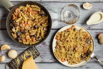 pasta in cream sauce with mushrooms, shrimp and cheese