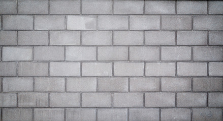 High resolution full frame background of a wall or building exterior made of light gray concrete...