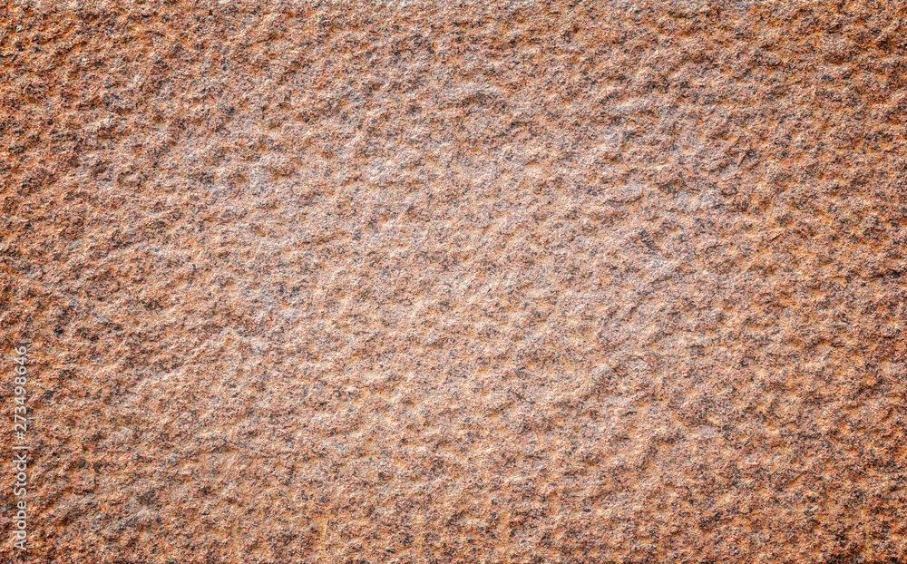 Aufkleber close-up of a bumpy red granite stone wall with vignetting. high resolution full frame background te