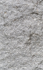 Close-up of white, fine-grained granite surface. High resolution full frame texture background.