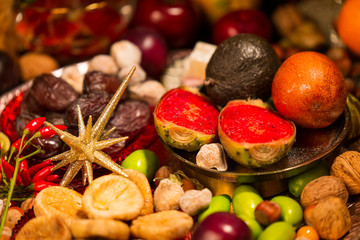 Close Up of Table decorated with Autumn and Winter Fruits and Edibles