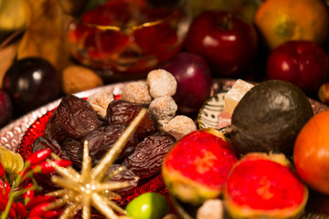 Close Up of Table decorated with Autumn and Winter Fruits and Edibles