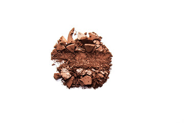 Brown eye shadow crushed samples isolated on white background. Concept of makeup and beauty.