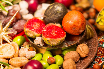 Close Up of Table decorated with Autumn and Winter Fruits and Edibles