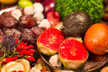 Close Up of Table decorated with Autumn and Winter Fruits and Edibles