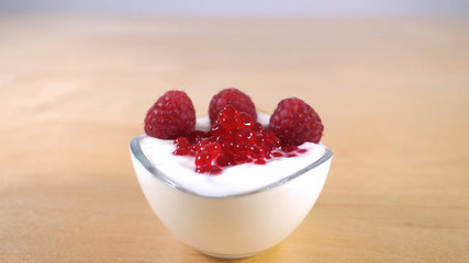 fresh raspberries in a glass bowl