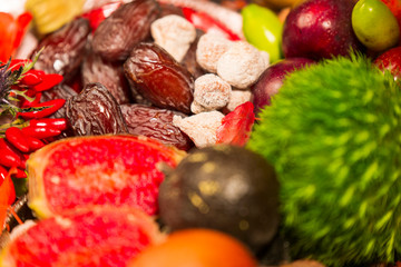 Close Up of Table decorated with Autumn and Winter Fruits and Edibles