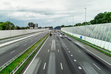 Traffic over the highway, motion blurred traffic, ring east A10, 06/14/2019 Amsterdam the Netherlands, speedway, freeway fast