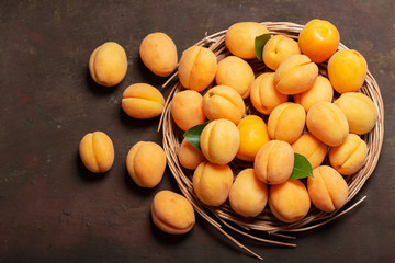 fresh apricots with leaves, top view