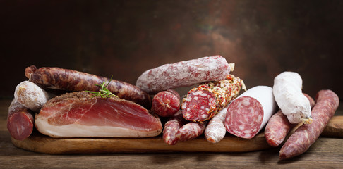 Various kind types of salami, speck and sausages